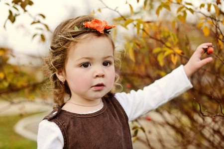 sweet  and fashion toddler girl in fallの写真素材