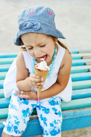 happy child with big ice cream coneの写真素材