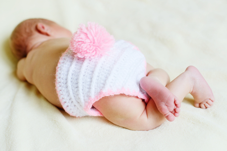 sweet sleeping newborn is wearing a bunny costumeの写真素材