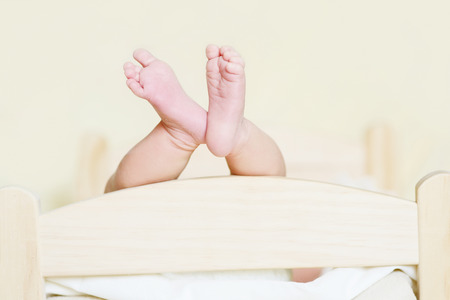 tiny foot of newborn baby in soft selective focusの写真素材