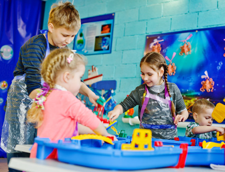 happy children is playing big water toyの写真素材