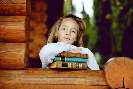 portrait of sweet and pretty  girl with booksの写真素材