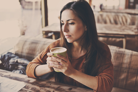 pretty woman in cafe with morning coffeeの写真素材
