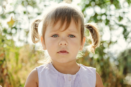Portrait of toddler girl with ponytail hairstyleの写真素材