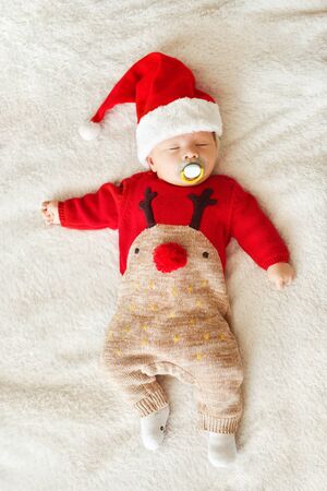 newborn baby boy wearing  Santa hat  and Christmas clothingの写真素材