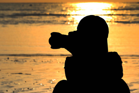 Female protograph sitting on the beachの写真素材