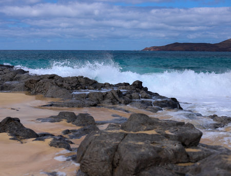 Waves breaking on the rocks on the beach in Lanzarote