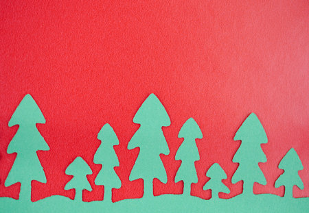 Green Paper Trees With Red Backgroundの写真素材