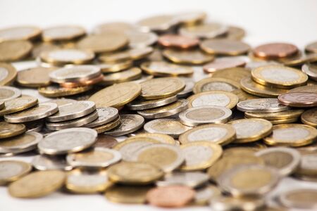 Currency in banknotes of different denominations with coins of different valueの写真素材