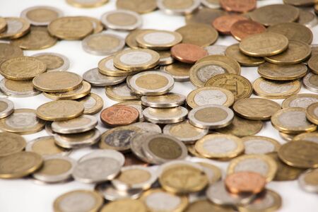 Currency in banknotes of different denominations with coins of different valueの写真素材