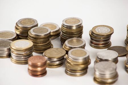 Currency in banknotes of different denominations with coins of different valueの写真素材