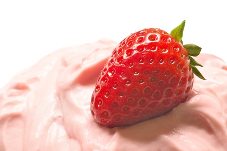 Strawberry on custard in closeupの写真素材