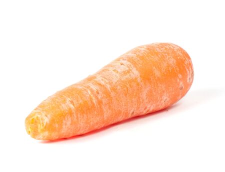 Single carrot lying on white background isolatedの写真素材