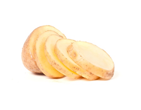 Sliced yellow potatoes isolated on white backgroundの写真素材