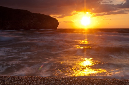 Beautiful shining sunset over the sea backgroundの写真素材