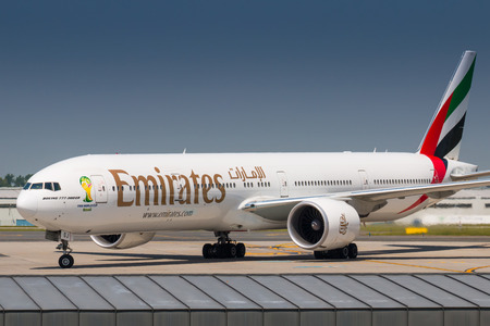 PRAGUE, CZECH REPUBLIC - MAY 22: Boeing 777-300ER Emirates taxis to terminal after landing at PRG Airport on May 22, 2014. Emirates is an airline based in Dubai.のeditorial素材