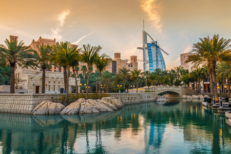 Dubai, UAE - March 29, 2015: View on Burj Al Arab from Madinat Jumeirah during sunset. Madinat is a luxury resort which include hotels and souk spreding across over 40 hectars.