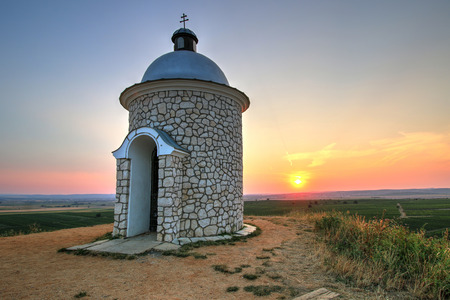 Pretty view on sunset with chapel near Velke Bilovice in Southern Moraviaの写真素材