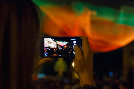 PRAGUE - OCTOBER 18, 2015: Girl takes photo of 1.26 installation by Janet Echelaman on Palackeho Square during the Prague Light festival Signalのeditorial素材