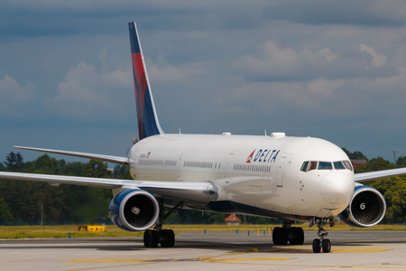 PRAGUE - JUNE 16: Delta Airlines Boeing B767-400 taxis after landing at PRG Airport on June 16, 2016 in Prague, France. Delta is one of the biggest airlines in the world serve over 300 destinations around the worldのeditorial素材