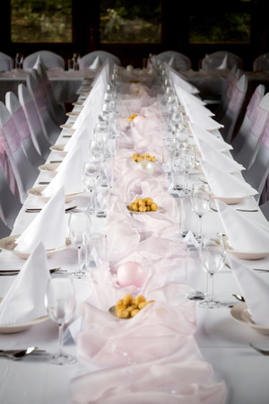 Table is prepared for happy wedding feastの写真素材