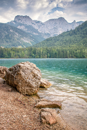 Nice clear water of the lake in the Alpsの写真素材
