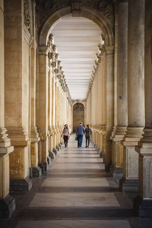 Karlovy vary, Czech republic - March 30, 2019: People at Mill Colonade in the famous column...