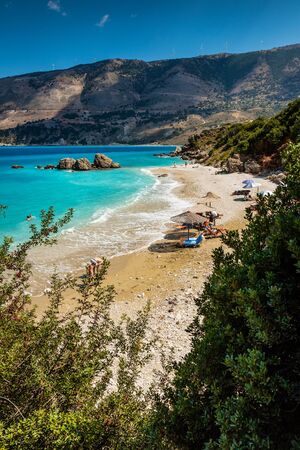 People relaxing at the Vouti beach in Kefalonia, Greece.の写真素材