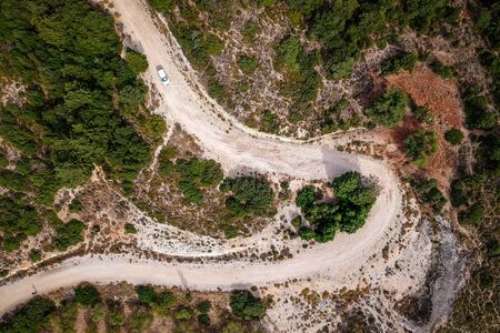 Aerial view on rocky road with curveの素材 [FY310144300710]