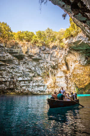 KEFALONIA, GREECE - SEPTEMBER, 13:Melissani Lake Cave: Tourist boat on the lake in Melissani Cave, Kefalonia Island, Greece on September 13, 2019,のeditorial素材