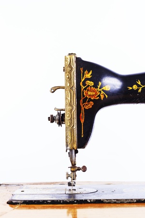 The old sewing machine on a white backgroundの写真素材