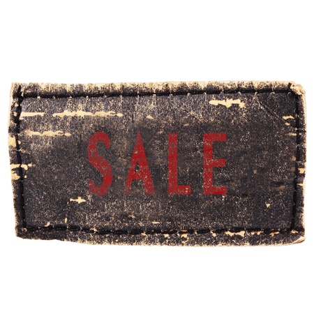 Sale text at jeans label isolated on whiteの写真素材