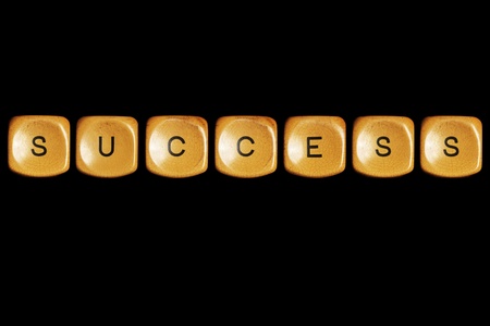 Grunge typewriter keyboard play on  success words . Isolated on a black background.の写真素材