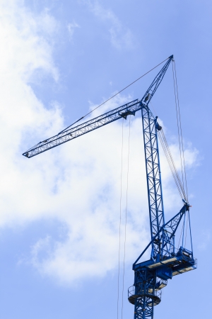 Crane boom on industrial site  against a clear blue skyの写真素材