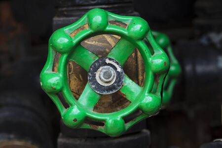 green rusty industrial faucet wheelの写真素材