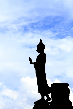 Buddha silhouette on blue sky の写真素材