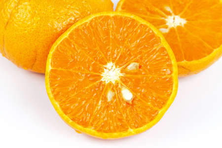 Sliced orange fruit segments on white backgroundの写真素材