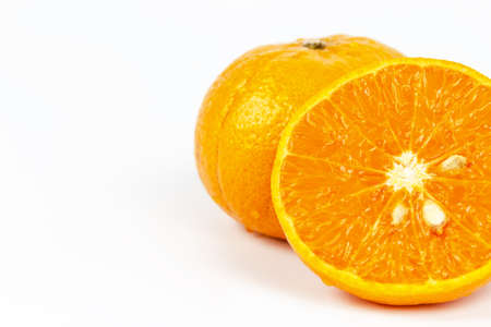 Sliced orange fruit segments on white backgroundの写真素材