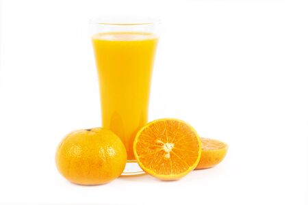 Orange juice and slices of orange on white backgroundの写真素材