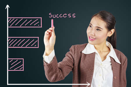 Business success growth chart.Asian businesswoman succeeding.の写真素材