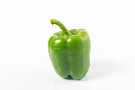 fresh green bell pepper  capsicum  on a white backgroundの写真素材