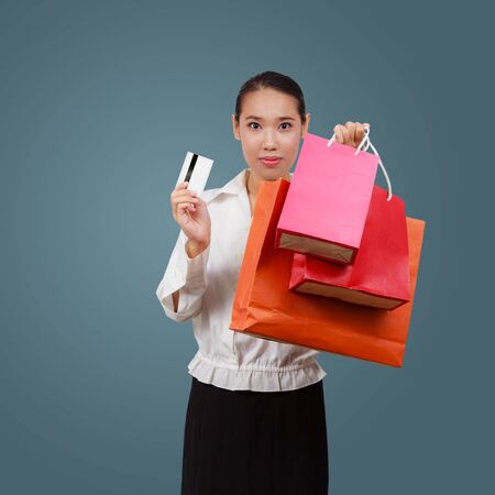 Beautiful shopping woman holding shopping bags.の写真素材