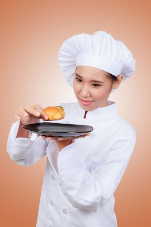 Chef showing bakery.の写真素材