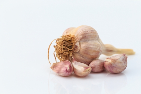 fresh garlic isolated on whiteの写真素材