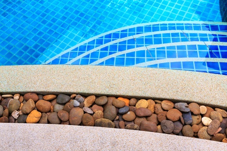swimming pool blue water detail in summer time