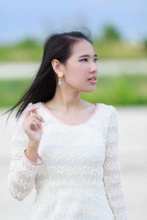Beautiful Asian woman enjoy nature meadow.の写真素材
