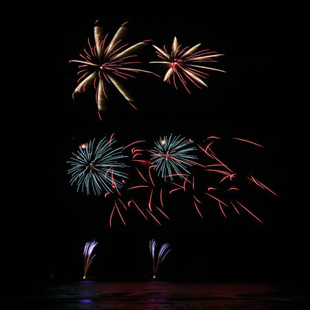 A delicate burst of fireworks in the night skyの写真素材