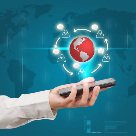 Modern mobile phone in a  businessman hand. Communications of digital business.の写真素材