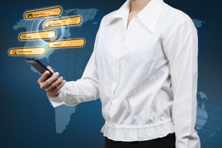 Businessman holding a smartphone. Concept for business communication on the network interface to Internet and world wide web connection.の写真素材