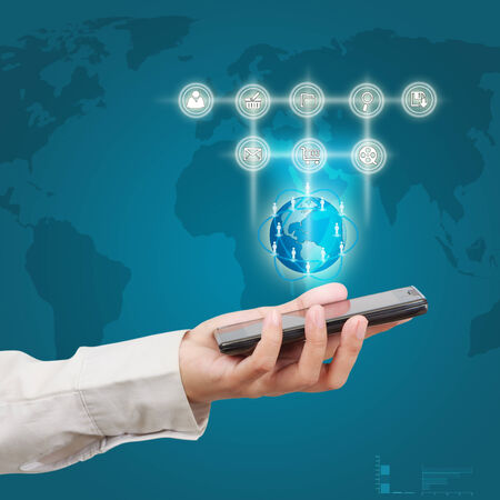 Businessman holding a smartphone  Concept for business communication on the network interface to Internet and world wide web connection の写真素材